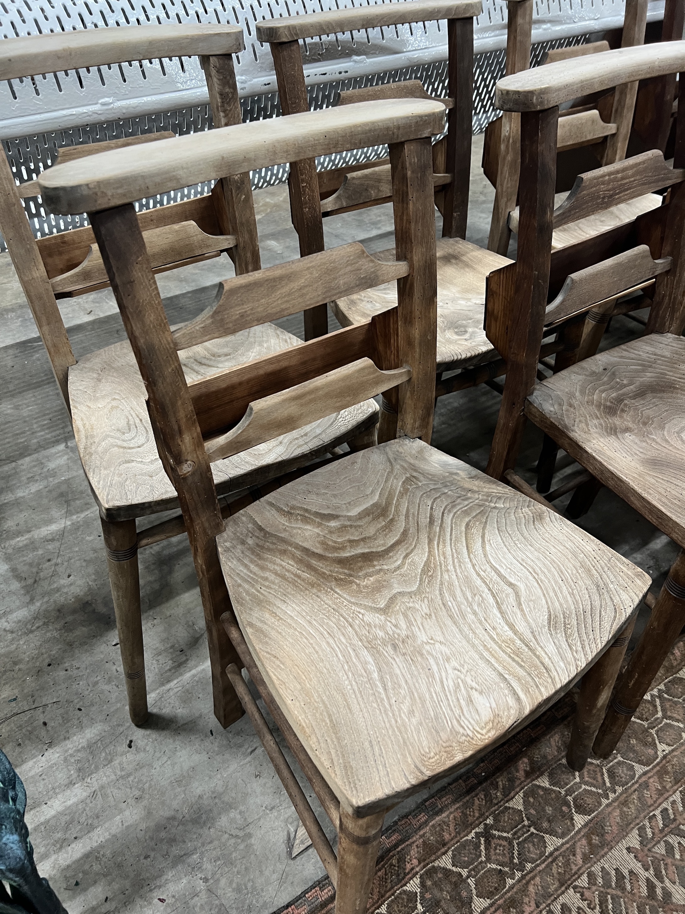 A set of ten elm and beech chapel chairs